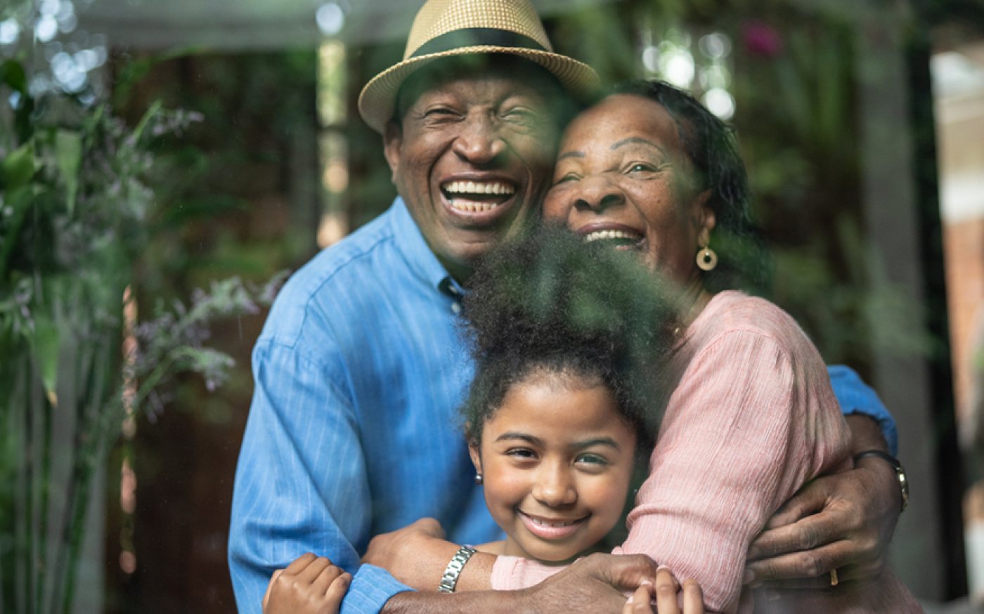 Family of three hugging