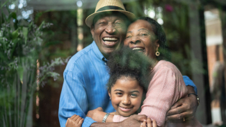 Family of three hugging
