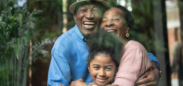 Family of three hugging